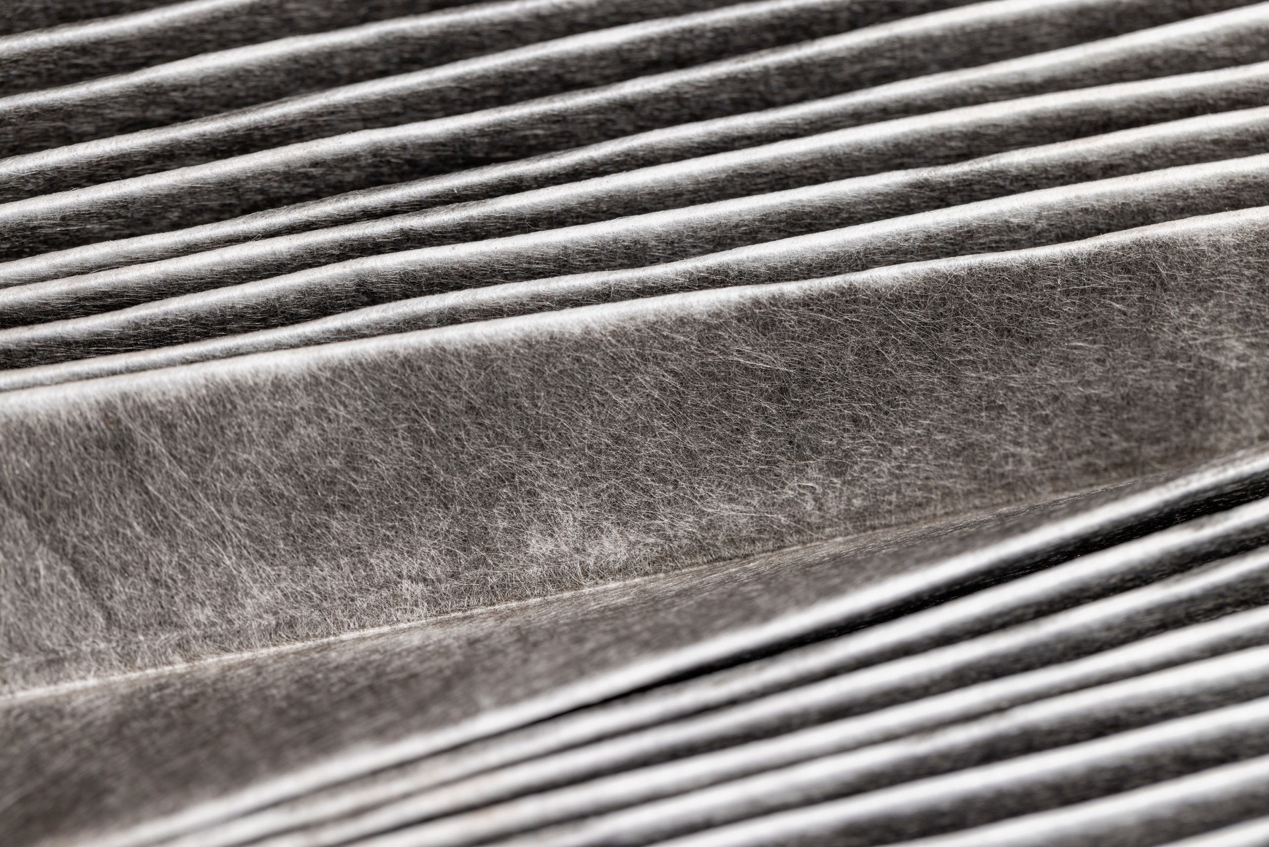 old dirty air filter, long-used blackened filter for dirt filtration